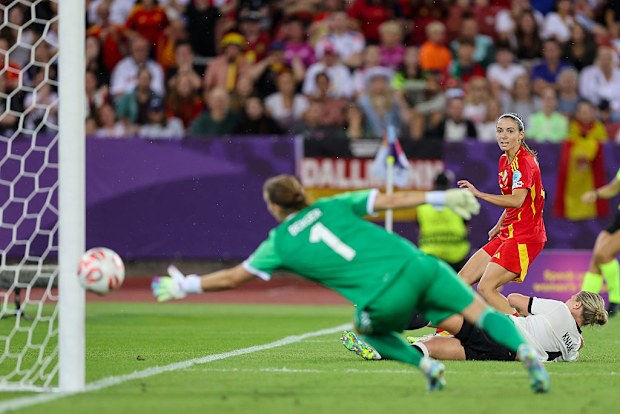 Aitana Bonmati of Spain scores the winning goal past Ann-Katrin Berger of Germany.
