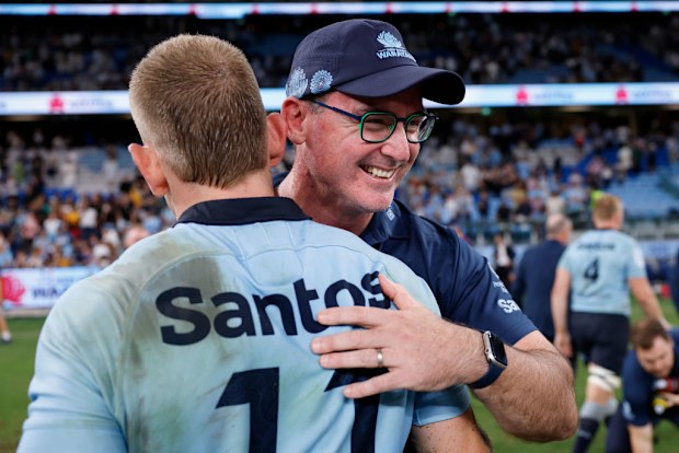 Coach of the Waratahs, Dan McKellar shares a moment with Max Jorgensen.