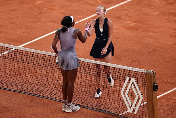 Anastasia Potapova of Austria and Coco Gauff of United States shake hands at the net.