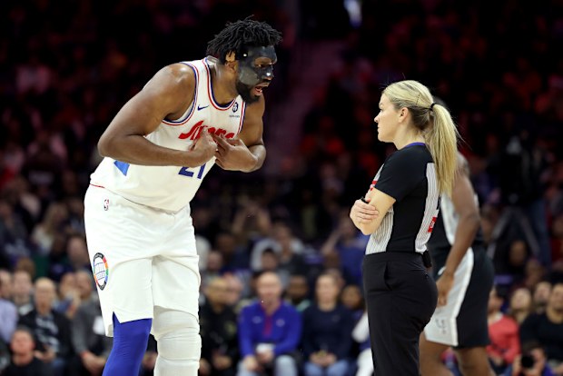 Joel Embiid #21 of the Philadelphia 76ers argues a call with referee Jenna Schroeder.