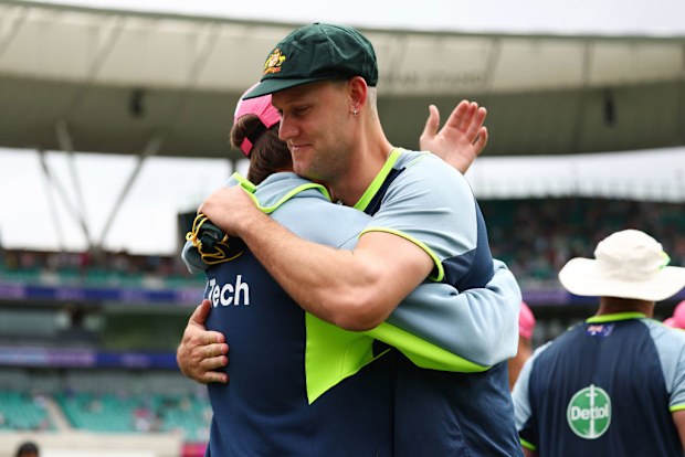 Mitchell Marsh of Australia congratulates Beau Webster of Australia after being presented with a Baggy Green.