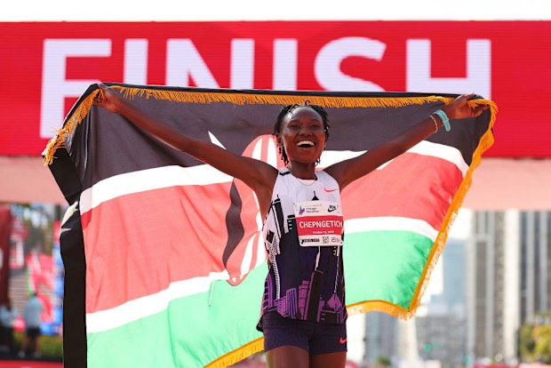 Ruth Chepngetich of Kenya celebrates after crossing the finish line to win the 2024 Chicago Marathon.