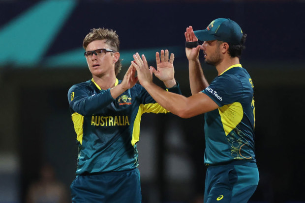 Adam Zampa celebrates with teammate Marcus Stoinis after bowling Bernard Scholtz of Namibia (not pictured) during the 2024 ICC Men's T20 Cricket World Cup.