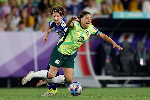 Sam Kerr of the Matildas is challenged by Hinata Miyazawa of Japan.
