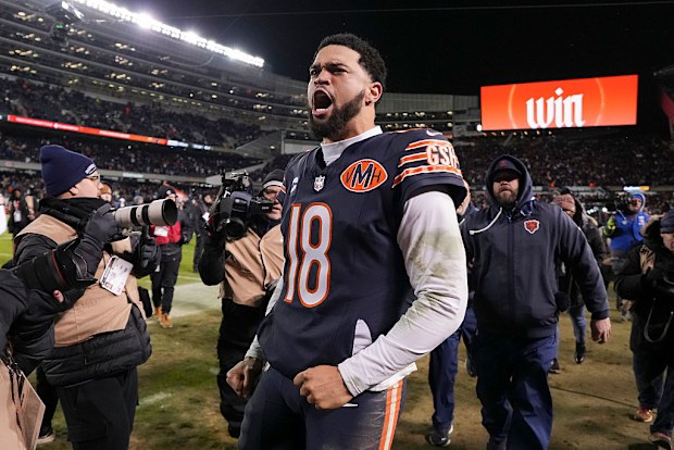 Caleb Williams celebrates after an NFL Wild Card game.