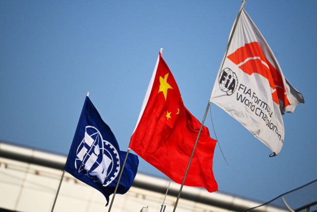 The FIA, China and Formula 1 flags fly in the Paddock during previews ahead of the F1 Grand Prix of China at Shanghai International Circuit on March 20, 2025 in Shanghai, China. (Photo by Mark Sutton - Formula 1/Formula 1 via Getty Images)