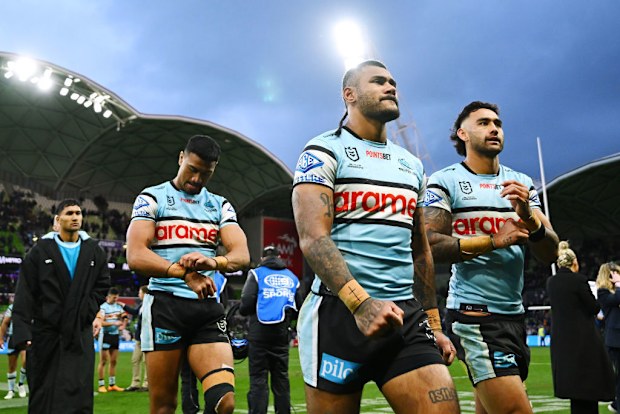 Sione Katoa and Briton Nikora of the Sharks walk off the field after losing the NRL Qualifying Final match between Melbourne Storm and Cronulla Sharks.
