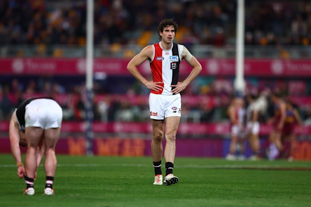 Max King of the Saints looks on.