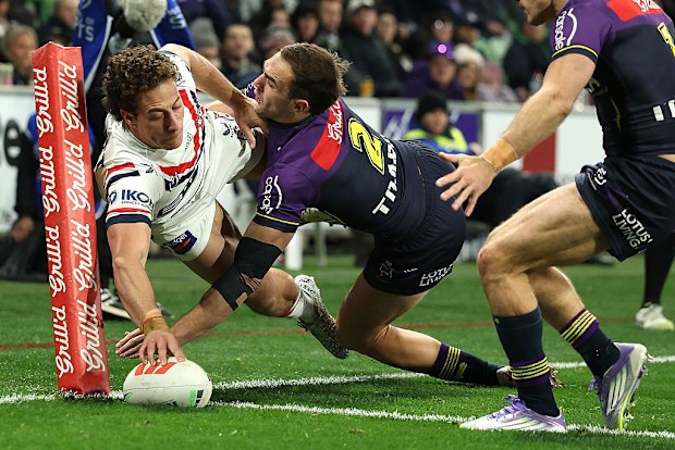 Mark Nawaqanitawase of the Roosters scores a try.