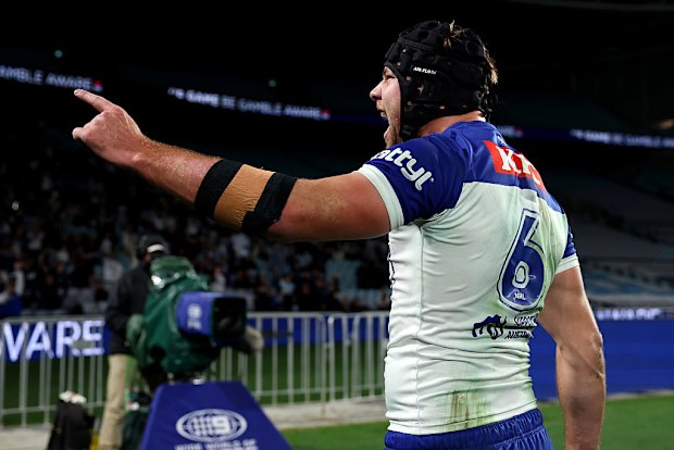 Matt Burton of the Bulldogs celebrates his try.