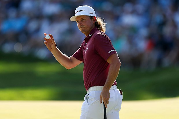 Cameron Smith of Australia acknowledges the crowd on the 18th green.