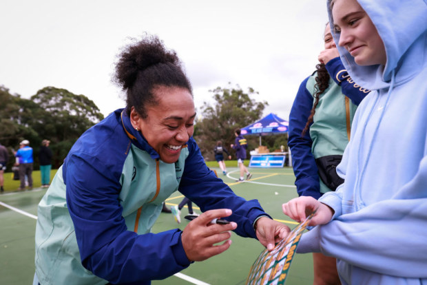Lydia Kavoa signs autographs during a Rugby Australia engagement day at Boronia Park.
