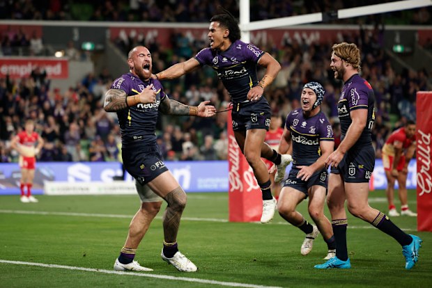Nelson Asofa-Solomona of the Storm celebrates scoring a try.