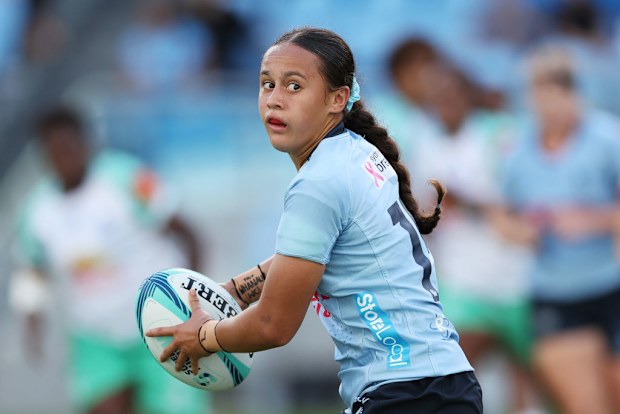 Waiaria Ellis of the Waratahs runs with the ball.