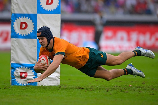 Josh Flook of Australia dives to score the team's second try.