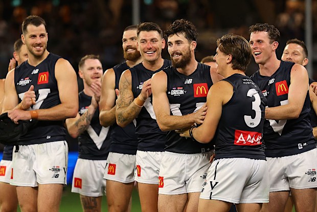 Teammates congratulate Lachie Ash after being announced the best on ground for Victoria.