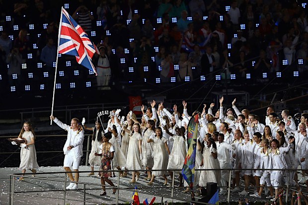 Sir Chris Hoy carries the Great Britain flag at the 2012 London Olympics opening ceremony.