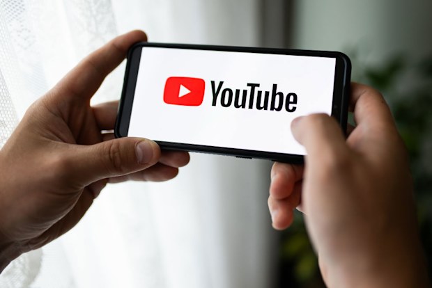 POLAND - 2023/07/13: In this photo illustration a YouTube logo seen displayed on a smartphone. (Photo Illustration by Mateusz Slodkowski/SOPA Images/LightRocket via Getty Images)