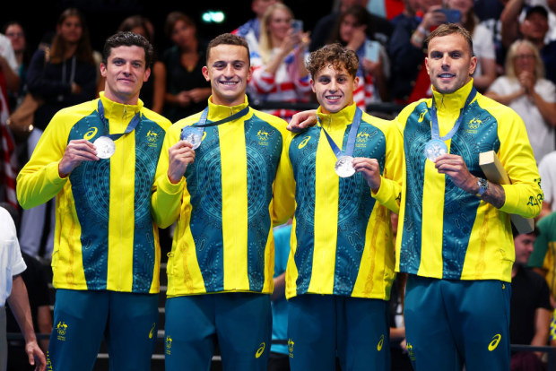 Silver Medalists (L-R), Jack Cartwright, Flynn Southam, Kai Taylor and Kyle Chalmers of Team Australia pose.