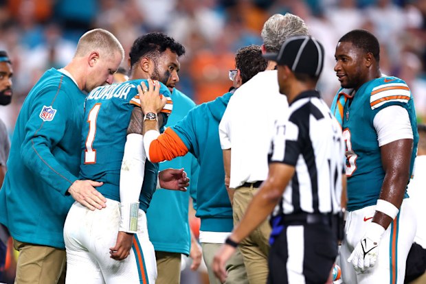 Tua Tagovailoa of the Miami Dolphins walks off the field.