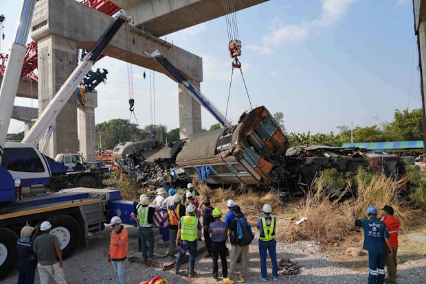 Crane falls into a passenger train in Thailand