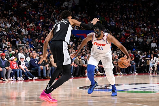 Joel Embiid #21 of the Philadelphia 76ers dribbles the ball.
