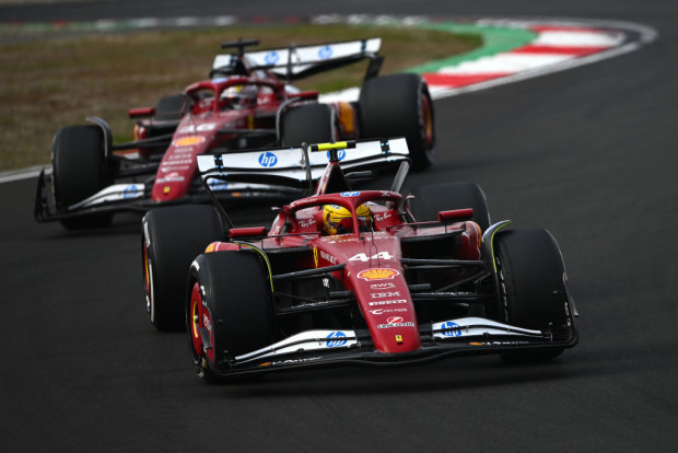 Lewis Hamilton of Great Britain driving the (44) Scuderia Ferrari SF-25 leads Charles Leclerc.