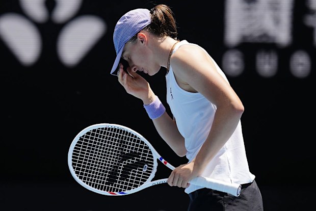 Iga Swiatek of Poland reacts against Elena Rybakina.