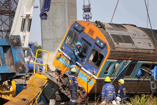 Crane falls into a passenger train in Thailand