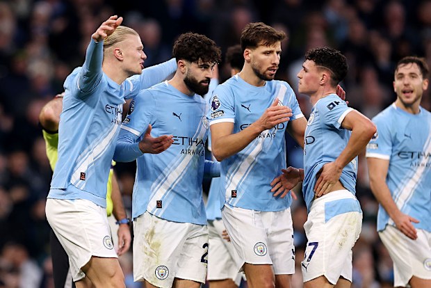 Manchester City players celebrate a win.