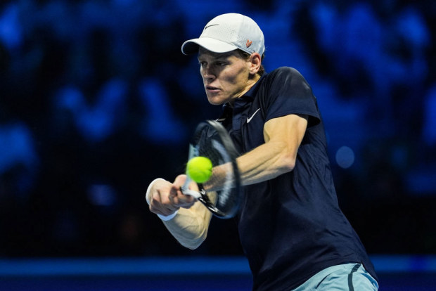 Jannik Sinner of Italy plays a backhand.