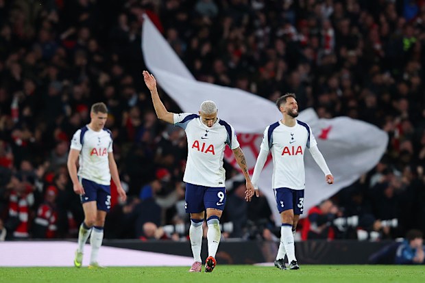 Richarlison of Tottenham looks dejected after Leandro Trossard of Arsenal scores.