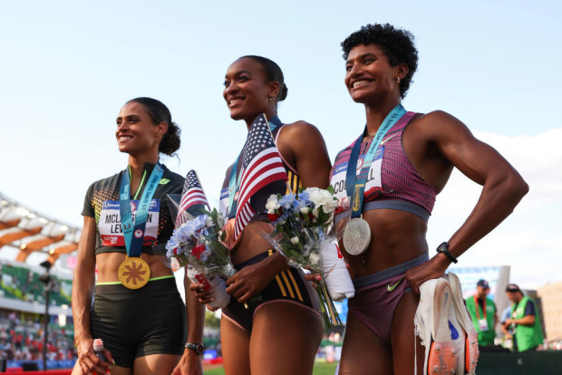 2024 U.S. Olympic Team Track & Field Trials: Women's 400 meter hurdles final; Gold medalist Sydney McLaughlin-Levrone, bronze medalist Jasmine Jones and silver medalist Anna Cockrell pose with their medals 