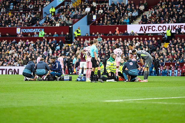 Adam Smith and Tyler Adams of Bournemouth receive treatment after a collision with each other.
