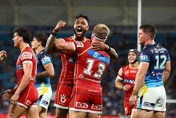 Max Plath of the Dolphins celebrates a try with Hamiso Tabuai-Fidow.