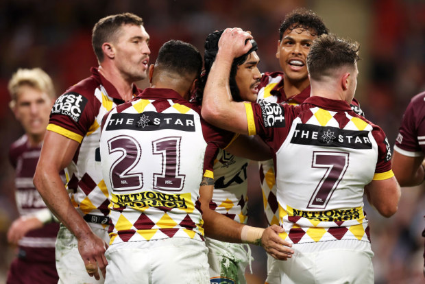 Broncos celebrate try.