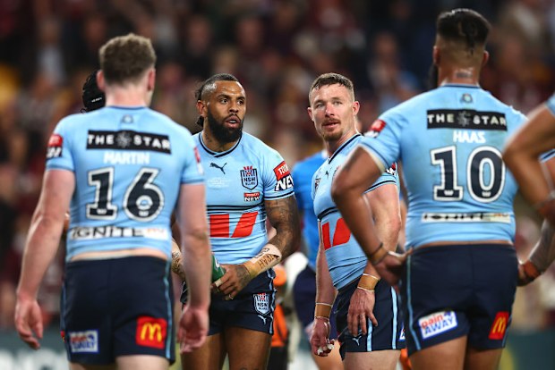 Josh Addo-Carr and Damien Cook react after another Queensland try. 