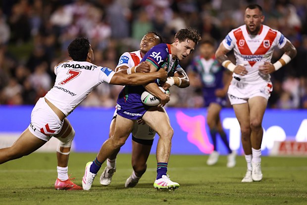 Luke Metcalf of the Warriors is tackled.