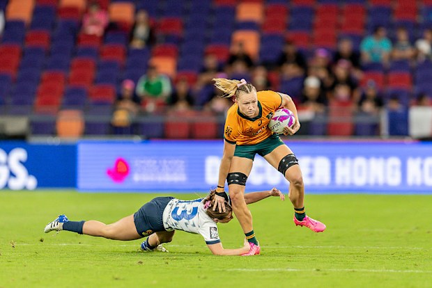 Maddison Levi of Australia runs with the ball.