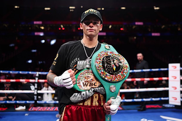 Ryan Garcia poses with the title belt.