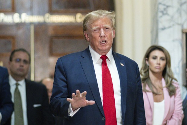 Former President Donald Trump speaks after exiting the courtroom for a break.