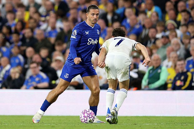 Jack Grealish of Everton runs with the ball whilst under pressure from Daniel James of Leeds United.