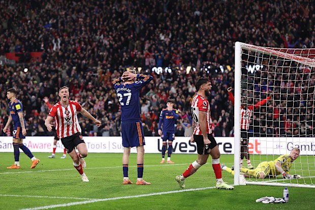 Nick Woltemade of Newcastle United reacts to conceding an own goal.