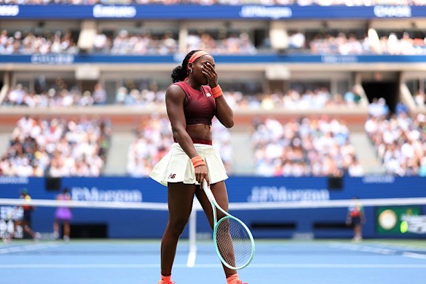 Coco Gauff of the United States reacts against Naomi Osaka of Japan.