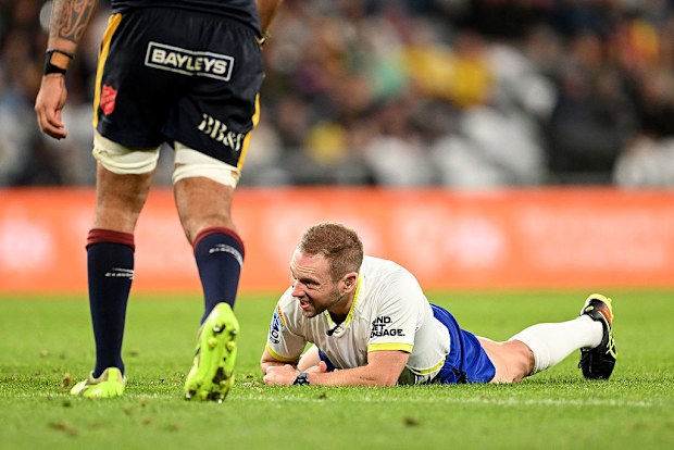 Referee Angus Gardner falls to the ground after having a collision with Hugh Renton of the Highlanders.