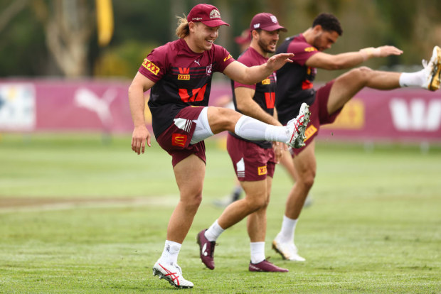 Reuben Cotter warming up in the Maroons camp.