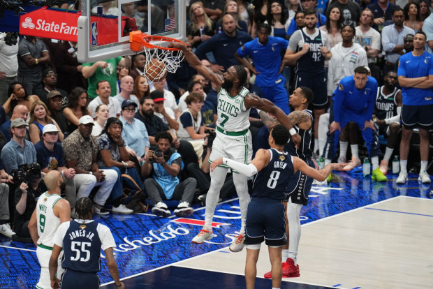 Jaylen Brown of the Boston Celtics dunks the ball.
