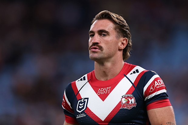 Connor Watson of the Roosters warms up.
