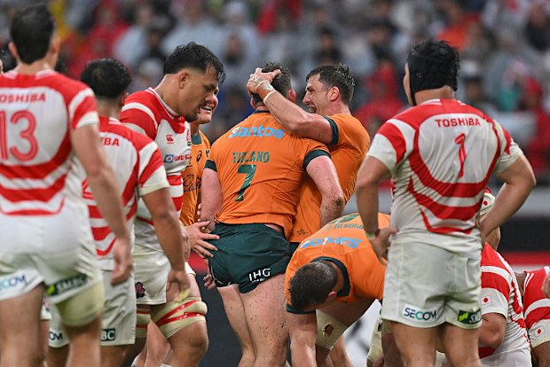Carlo Tizzano of Australia celebrates scoring the team's third try.