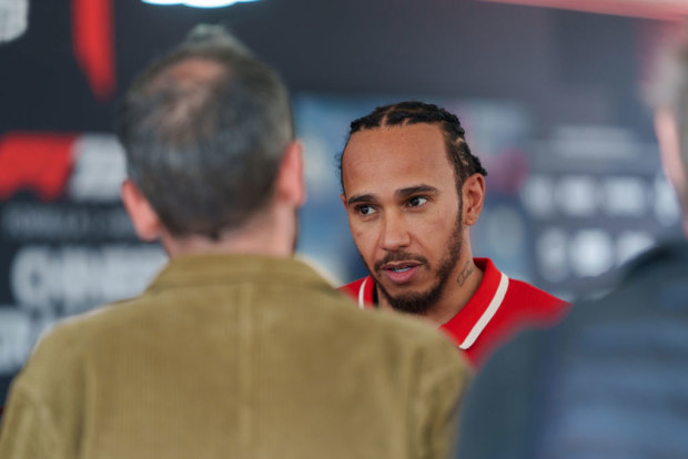 Ferrari driver Lewis Hamilton of Britain receives an interview after the sprint race of the Formula One Chinese Grand Prix at the Shanghai International Circuit on March 22, 2025 in Shanghai, China. (Photo by VCG/VCG via Getty Images)